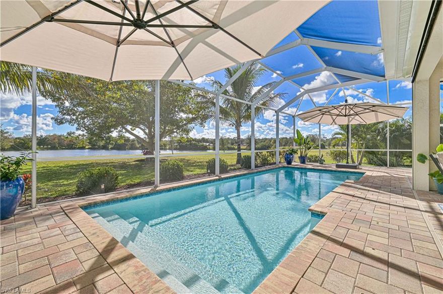 Welcome home to your private lakeside retreat! This property is perfectly positioned on a 1-acre waterfront lot within an exclusive gated community known for its privacy, security, and friendly atmosphere. From the moment you arrive, the setting feels special—lush mature landscaping, tranquil lake and fountain views, and a backyard designed to elevate everyday living. Relax poolside, entertain effortlessly, or take advantage of the community’s private boat ramp with direct access to the Caloosahatchee River, ideal for boating and waterfront adventures. Flood Zone X so no flood insurance is required!
This thoughtfully designed home offers 3 bedrooms plus a den on the main level, along with a spacious bonus room upstairs with a full bath—perfect as a media room, game room, guest suite, or additional bedroom. With 4 full and 2 half baths, and lots of storage the layout provides exceptional flexibility and comfort for family and guests alike.
Inside the soaring 11’ tray ceilings, designer lighting, and modern plank tile flooring create an open, airy atmosphere that feels both elegant and inviting. Brand-new impact-resistant windows offers peace of mind. 
The kitchen is a true centerpiece, featuring a large island, white shaker-style cabinetry, a French-door stainless refrigerator, dual convection ovens, and granite countertops—designed to make cooking and hosting a pleasure. The open-concept layout connects seamlessly to the living and dining spaces, with porcelain tile throughout the main floor and plush Stainmaster carpet upstairs for added comfort.
This home is perfect for entertaining, the living room sliders open and pocket to the 40’ x 30’ covered lanai and large pool enclosure with no-seeum screens. Outdoor living is a dream come true, heated saltwater pool complete with an outdoor pool bath, hurricane-impact motorized screens, and its pre-wired for an outdoor kitchen. Whether you’re entertaining guests or unwinding at sunset, the peaceful lake and fountain views provide a stunning backdrop.
Additional features include a whole-home reverse osmosis system, generator wiring, 100-amp EV charger, fresh interior paint, 3 car garage and an extra-long driveway accommodating 9–12 vehicles—perfect for gatherings or car enthusiasts. For those looking for move in ready & turnkey the designer furnishings can be purchased separate from an offer. 
Ideally located just minutes from shopping and dining and only 10 minutes to I-75, this home shows like a model and offers the perfect balance of serene waterfront living and everyday convenience.
Schedule your showing today and experience this exceptional home for yourself.