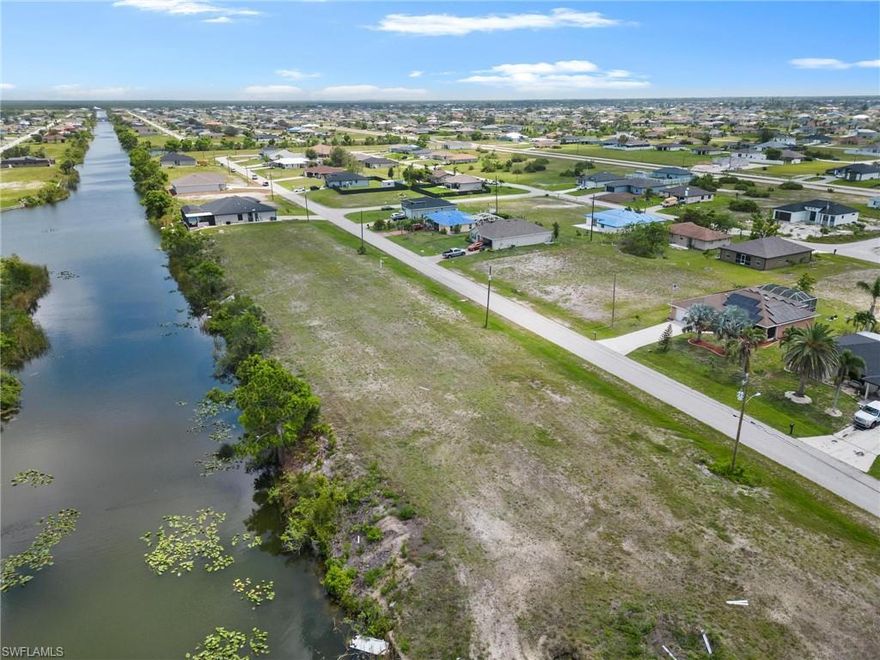 Welcome to your dream home opportunity! This vacant lot is situated on a freshwater canal in the beautiful neighborhood of Cape Coral, offering the perfect chance to build a customized living space exactly as you envision it. This location offers unbeatable convenience for all your family's needs. Whether you're looking for an investment property or a stunning new home, this spot has everything you need—and more! Take advantage of its bike and dog-friendly atmosphere by taking leisurely strolls along the canal or take your furry companion for some fun outdoor playtime. Plus, with nearby shops, hospital, church and waterpark activities only minutes away from your doorstep, it's easy to stay healthy and happy in this tranquil environment. And don't forget that Fort Myers & Punta Gorda airports are just a few miles away so that when it comes time to get away from it all at Sanibel Island beach or other nearby beaches like Captiva or Fort Myers Beach—you won't have far to go! Start building the life of your dreams today with this incredible vacant lot opportunity in Cape Coral. Come enjoy the salty beach life now!