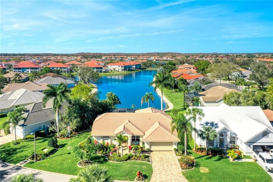 Exceptional Lakefront Pool Home in gated enclave of single family homes known as *Fairway Isles South*, within the award winning community of Gateway. This 4BR + Den, 2Bath open bright and airy residence, is ideally situated with waterfall Pool & facing west, affording unobstructed colorful sunsets from the privacy of your [picture window] screened Lanai. To thoroughly appreciate this offering please click on the Virtual Tour and view the extensive photos of this home with vaulted ceilings throughout, formal & Breakfast room dining, spacious open Kitchen with granite counters, wooden cabinetry, large center island.  Outside the home with its brick paver driveway to include pavers and curbed walkways around home, with showcase landscaping + timed lighting making a statement the envy of *Fairway Isles* neighbors.  Optional - golf or social membership can be purchased at The Club at Gateway. Living here allows you to have EZ access to nearby SWFL Int’l airport (RSW), minutes from the Minnesota Twins Jet Blue Stadium, or a few miles from I-75 for great nearby shopping Malls etc.  Schedule your private viewing today.  Remember the 1609 Proverb “Seeing is Believing”.