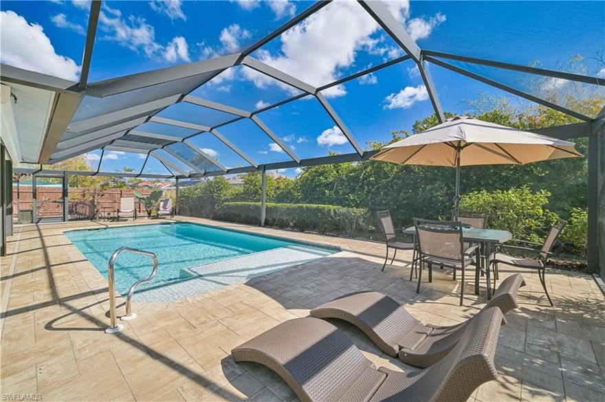 Stunning POOL HOME ready for you to move right in and enjoy!! Excellent location minutes from beaches, airport, FGCU, shopping, dining, entertainment and right around the corner from a golf course! Light, bright, clean as a whistle, and well-maintained with major items already done for you! NEW ROOF & Garage Door in 2023!! Pool Renovation and new pool cage with picture window panels in 2020!! New Water Heater 2021! AC replacement 2019 with all new HVAC ducting in 2025! Accordian Shutters on windows and Roll-down shutters surrounding the covered portion of Lanai! Gorgeous Tile throughout the entire home! Brand new stainless steel Refrigerator, Dishwasher and Range Hood! Updated Kitchen Countertops! Extra Storage and desk area in kitchen providing extra work space! Updated Primary Bathroom! All of the huge Lanai Paver area has just been cleaned, resanded and sealed! Back yard is privacy fenced, has a shed, and sits along a pretty and serene canal. NO HOA!! City water & sewer!