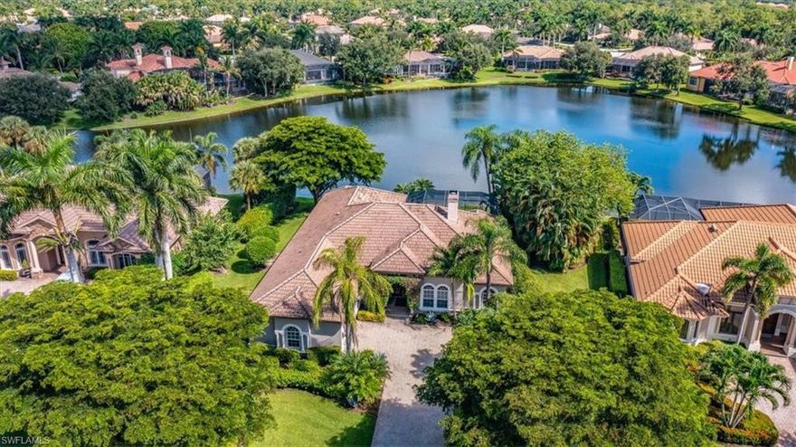 H6995. Updated four bedroom plus den, three bath furnished single family home with gorgeous lake views in the sought after community of The Classics in Lely Resort.  Remodeled in 2019 to provide desirable open great room floor plan plus quartz countertops and island in kitchen.  Additional features include new stainless appliances, COREtec flooring in all bedrooms and office, new quartz countertops in all bathrooms, Plantation shutters throughout, and fireplace in living room.  The expansive lanai offers both heated pool and spa with waterfall feature, under cover seating as well as plenty of open space for sun tanning overlooking the lake.  Additionally, there is a two car, air conditioned garage and electric rolldown storm shutters. The Player's Club & Spa membership is optional with this home, not required.  Lely Resort is also home to three championship 18-hole golf courses of which two are public and one is private.  Close to downtown shopping, restaurants, and white sandy beaches!