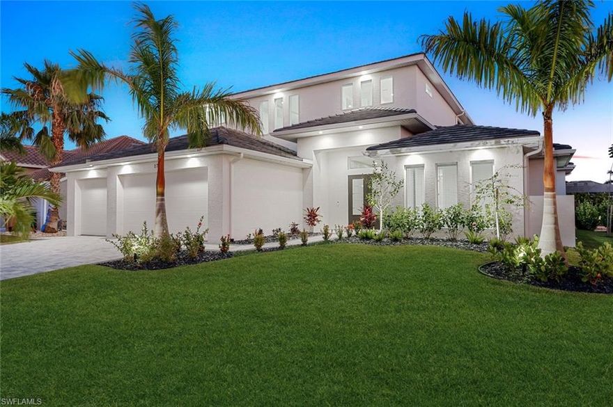 Experience unparalleled luxury in this newly constructed, GULF ACCESS southern exposure home, perfectly situated in the sought-after SW Cape Coral area, just minutes from Cape Harbour and directly across from Camelot Park. This exquisite property boasts over 4,100 sq ft of living area with 4 large bedrooms, 4 1/2 baths plus a spacious den, 3 car garage, and is being sold turnkey with all furnishings. The home is designed for those who appreciate the finer things in life, offering a wealth of high-end features and modern conveniences. Enjoy the convenience of dual master suites, providing flexible living arrangements, with a spacious second bedroom upstairs that comes with a shared ensuite, perfect for family or guests. The home features sophisticated tray ceilings throughout and thoughtfully designed soffit lighting that enhances its exterior appeal. The outdoor living space is a true oasis, boasting a state-of-the-art Pentair control system for the luxurious saltwater pool, a swim-up bar, hot tub, and sundeck. Entertain in style with an outdoor kitchen complete with a separate grill station, a large upper balcony offering stunning views, and a charming tiki hut. Boating enthusiasts will appreciate the new composite dock with a 12k boat lift on the extra-wide canal. Inside, the upper living area includes a wet bar/kitchen equipped with a dishwasher and fridge, along with a large second living room ideal for entertaining. The home also features a pool table, perfect for game nights with family and friends, and a gourmet kitchen with a double oven and spacious pantry catering to all your culinary needs. All windows and doors are impact-resistant, ensuring safety and peace of mind, while a modern flat tile roof adds to the home's stylish exterior. Additional amenities include a separate pool bath conveniently located for easy access from the pool area, a hot tub, and a sundeck for relaxation and unwinding. This luxury waterfront home combines elegance, comfort, and functionality, making it a perfect choice for those seeking an upscale lifestyle in SW Cape Coral. Don’t miss the opportunity to own this extraordinary property.