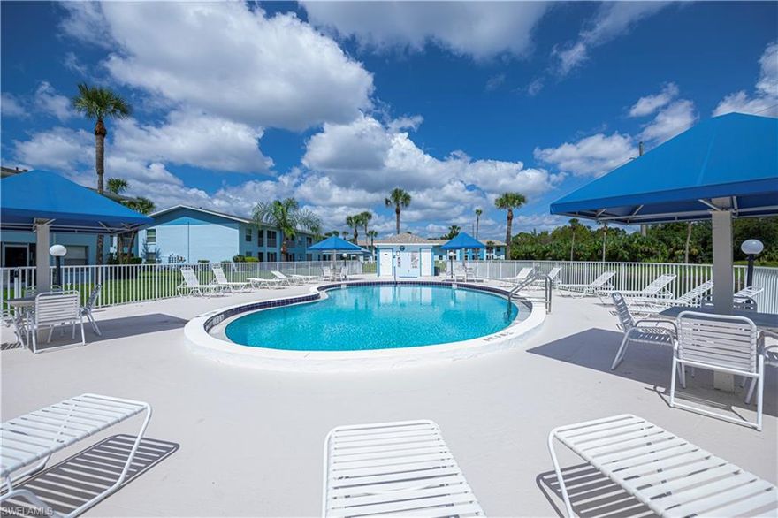 TURNKEY - Its ALL YOURS!! NO LOWBALL OFFERS! Property is already priced accordingly. OWN a slice of Florida's LIFESTYLE and live here full-time or seasonally!! Royal Hawaiian Club Condos offers a peaceful, neighborly vibe that's located just minutes from many waterfront  restaurants and everyday necessities shopping just a skip away!! Built with solid concrete block and topped with brand-new shingle roofs, these well-maintained buildings and pools combine strength and style. NO FLOODING and no flood insurance required here! This 2 Bedroom ~ 2 Full Bathrooms upstairs condo showcases stellar views from the inside as well as the lanai!! The Living Room, Kitchen and Dining Room are open, bright and spacious for everyone to enjoy at the same time. The Master suite offers his and hers styled closet, private full bathroom and access to the lanai to catch the morning sunrise. You can see the community pool just around the corner, it’s easy to grab your floatie and cooler and soak up the vitamin D while you relax on a lounge chair. A private interior stackable washer and dryer are tucked conveniently in the hallway making it super convenient!!
You will find your assigned parking spot (#206) is right at the bottom of the steps. Guest parking? Plenty of it. Royal Hawaiian Club is one of the MOST AFFORDABLE HOA fees in the area—just $399 per month—and that covers water, sewer, trash, pest control, building insurance, management fees, roof maintenance and all exterior upkeep.  Just a few hours away from Orlando theme parks, Florida Keys or Miami. WHY RENT THE DREAM WHEN YOU CAN LIVE IT? Royal Hawaiian blends vacation energy with everyday affordability. Make this condo YOURS today!!