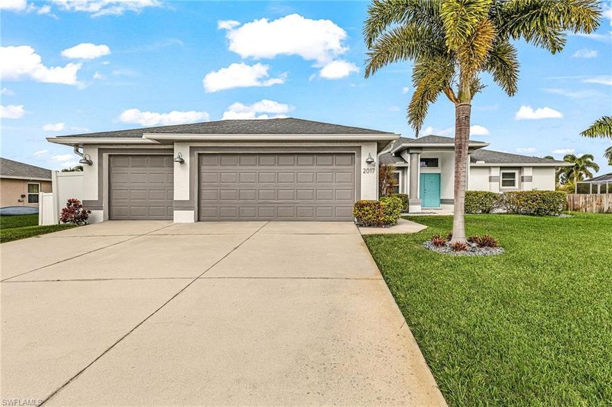 Very few homes offer this combination of size, updates, location, an oversized triple lot, and a non-flood zone setting—making this a truly unique opportunity. Welcome home to this beautifully updated 4-bedroom, 3-bath, 3-car garage pool home situated on a triple lot in desirable SW Cape Coral. As you enter, you’re drawn through the bright, open living space toward the sliding glass doors leading to the screened lanai and heated pool, where natural light pours in and palm trees sway, creating a peaceful, resort-like setting. Inside, the home features laminate flooring throughout, new quartz kitchen countertops, fresh interior and exterior paint, new ceiling fans, lighting, faucets, landscape lighting, and newly planted fruit and palm trees. Major improvements include a newer roof, impact windows, A/C, hot water heater, and a white vinyl privacy fence, all of which add significant value for the next owner. The well-designed 4/3/3 layout offers exceptional flexibility. Three of the four bedrooms feature very spacious walk-in closets, while one guest bedroom includes a Murphy bed and desk, making it ideal as a home office or comfortable guest space. The fenced in triple lot provides ample room for outdoor living, added privacy, and possibilities rarely found. Not located in a flood zone—no flood insurance required; however, the owners do maintain a transferable policy, if desired. All of this is located in a prime SW Cape Coral neighborhood, close to schools, shopping, dining, marinas, and beautiful Gulf beaches.