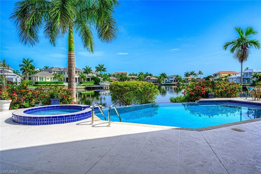 An oasis that catches best of the Naples sunrises & sunsets. Offering expansive water-views. A boaters paradise, only minutes to doctors pass, and you don't have to worry about canal depth. Minutes away form downtown Naples and Venetian Village. Best value in Parkshore waterfront properties. This property welcomes you with a long circular driveway, newer roof, AC, hurricane shutters and Plantation shutters through out the property. Gorgeous water views from every room in the property. Marble floors, new carpet, hand painted murals are just a few of the stunning interior features. Access the spacious outdoor living area from master bedroom, living room, family room, kitchen, you name it. The spacious loft with gorgeous view of the bay is so inviting. There is also a kitchenette off of the guest suite in the second floor. Enjoy sunset views from the balcony while sipping your wine. Set sail and drop anchor at this waterfront boat friendly property.