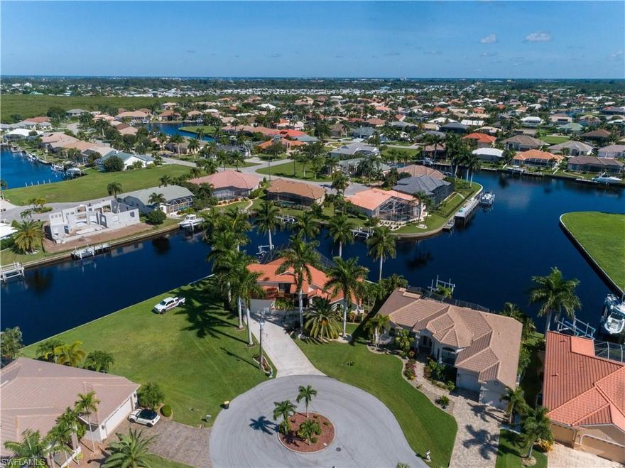Amazing 2 story home located on Rare Tip Lot 180’ (Seawall replaced 2020) of pristine sailboat access waterfront, the best view BSI has to offer! PGT impact windows and doors throughout. Home has 4 bedrooms, 2.5 baths, 2 car garage and an award winning pool. The kitchen is an entertainers dream, custom cabinetry, stone countertops and professional grade appliances. 3 zoned AC for efficiency and comfort. Master suite spans the entire 2nd story with balconies on both front and rear. 3 bedrooms on first floor. Two story screened in lanai surrounded by fabulous Royal Palms. Whole home water treatment including RSO, alarm, 6000 lb boat lift, so much to offer. A must see.