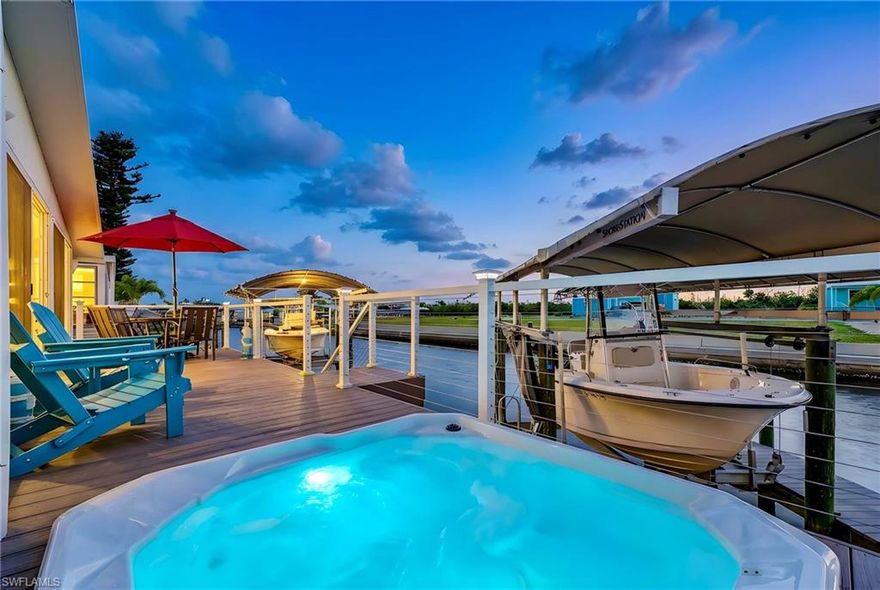 Welcome to 2991 Sloop Lane, a beautifully updated 3-bedroom, 2-bath waterfront retreat tucked away in the coveted Cherry Estates neighborhood of St. James City—where days move slower, sunsets steal the show, and life feels exactly how it should.

This home has been thoughtfully remodeled from top to bottom with comfort, style, and effortless island living in mind—and for peace of mind, it has remained high and dry and has never flooded. Inside, you’ll find new flooring, updated bathrooms, and a bright, inviting layout that flows seamlessly from room to room. The real showstopper? The air-conditioned sunroom, where expansive water views create a front-row seat to nature’s daily performance—coffee in the morning, cocktails in the evening, and everything in between.

Step outside and the lifestyle gets even better. A new Trex deck stretches out toward the water, offering plenty of space for entertaining, sunbathing, or doing absolutely nothing (which is highly encouraged here). Built right into the deck is a sunken hot tub, perfectly positioned for evening soaks under the stars or post-boating relaxation. Speaking of boating, the private boat lift makes it easy to be on the water at a moment’s notice—because the best days are the unplanned ones.

Offered turn-key furnished, this property is truly ready to go. Bring your toothbrush, your flip-flops, and your favorite playlist—everything else is already here. Whether you plan to use it as a personal island escape, a seasonal retreat, or a highly attractive vacation rental, this home checks every box. The combination of waterfront access, outdoor living space, move-in-ready convenience, and a proven high-and-dry history makes it especially appealing for short-term or seasonal guests seeking the authentic Pine Island experience.

Located in Cherry Estates, one of Pine Island’s most sought-after neighborhoods, you’ll enjoy a relaxed coastal atmosphere with easy access to boating, fishing, dining, and all the charm St. James City is known for—without the crowds or chaos of busier island destinations.

This is the kind of home that makes weekends feel longer, weekdays feel optional, and returning to “real life” feel mildly inconvenient. Whether you’re watching dolphins glide by, soaking in the hot tub at sunset, or heading out for an evening cruise, 2991 Sloop Lane offers a lifestyle that’s hard to beat—and even harder to give up.

Fair warning: once you’re here, everything else may feel a little too far from the water.