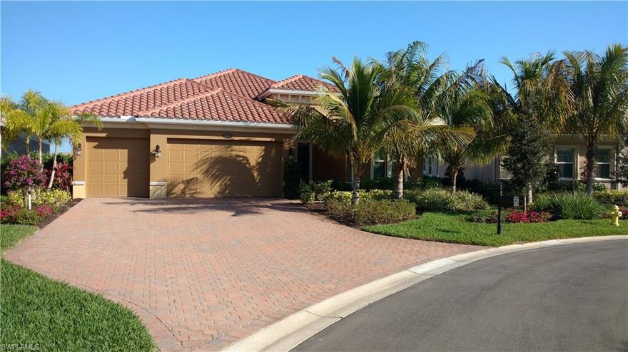 Better than new great room home with a long lake view.  This home features all the upgrades including wood floors, custom cabinets, granite in all baths, high ceilings with trays and built in coffers, large den with french doors, extra built in lighting, impact windows and doors, tank less hot water heater, outdoor kitchen, large pool/spa deck with water features and pool bath,  and much, much more.  Quite cul-de-sac lot with lots of privacy!  Fiddler's Creek offers world class combination of amenities including Social Club, Day Spa, state of the art Fitness wing, Tennis, and optional Golf and Beach/Marina.  Master Association Fee is included in yearly tax bill.  CDD DEBT SERVICE IS PAID OFF!