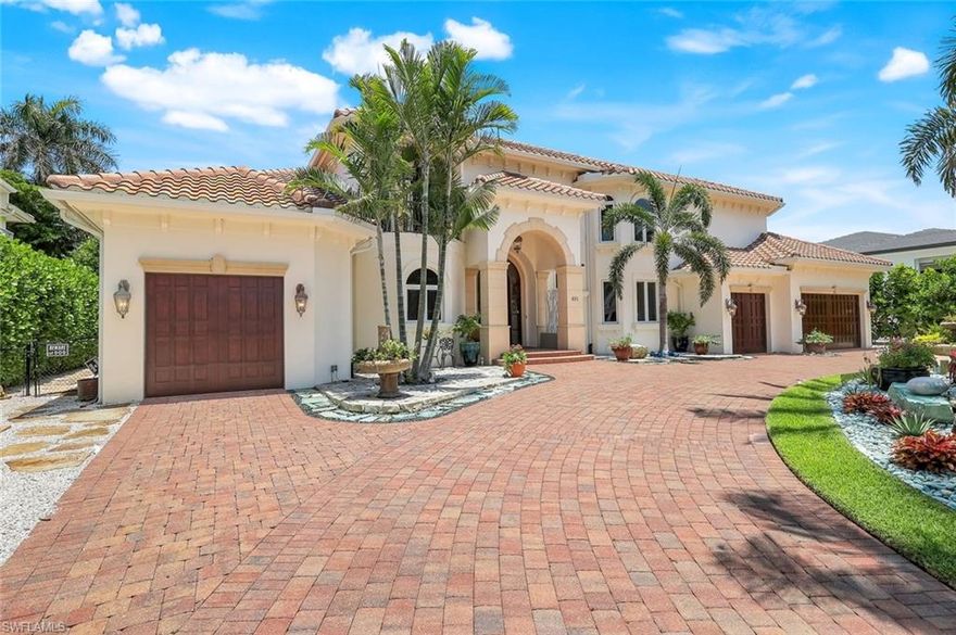 Live the Ultimate COASTAL LIFESTYLE in The Moorings!

Discover an opportunity to own nearly 4,000 sq. ft. of coastal luxury in one of Naples’ most coveted neighborhoods—THE MOORINGS—just minutes from the Gulf. Impeccably designed with no detail spared, this show-stopping residence blends sophisticated design with effortless functionality. With a grand GROUND-FLOOR PRIMARY SUITE, it’s gracious, easy living at its VERY BEST!

Step into the heart of the home: a NEW chef-inspired KITCHEN with high-end appliances including a VIKING Stove with six gas burners, griddle, and two ovens, a Viking refrigerator, BOSCH dishwasher, an elegant butler’s pantry & a custom coffee/bar station with wine cooler. From vaulted ceilings and crown moldings to the sweeping staircase rising from a grand foyer, timeless architecture meets modern flair.

The floor plan offers FOUR EN-SUITE BEDROOMS, a home OFFICE, a bonus LOFT, and TWO POWDER ROOMS. The FIRST-FLOOR PRIMARY SUITE is a true sanctuary, featuring a spa bath, a walk-in closet, and a serene pool access with a tropical view. Step outside into your BACKYARD OASIS, designed for year-round entertaining. Enjoy a heated SALTWATER POOL and spa, OUTDOOR KITCHEN with icemaker and refrigerator, tropical landscaping, & a fire pit that invites evenings under the stars—all behind a fully fenced yard that ensures privacy with ambiance. The 4-CAR GARAGE with mini-split air conditioners is incomparable. As a resident of The Moorings, you’ll have the option to join the Moorings Property Owners Association, offering private BEACH ACCESS, dedicated parking, & a dining pavilion STEP FROM THE SAND.

Whether you’re hosting friends, savoring quiet luxury, or catching sunsets at the beach, this home delivers the ultimate Naples lifestyle—elegant, effortless, & most EXCEPTIONAL!