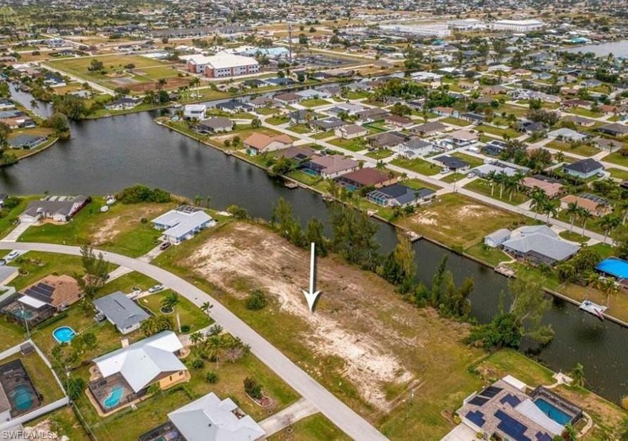 Welcome to the heart of Southwest Florida living! This exceptional triple lot in sunny Cape Coral offers a rare opportunity to build your dream home in a tropical paradise. Situated along the picturesque Escarade Canal with access to the tranquil Weatherly Lake, it’s perfect for kayaking, fishing, and soaking in the beauty of waterfront living.

This expansive property provides ample space to create a custom retreat tailored to your lifestyle. Whether you envision a spacious residence, a dedicated RV or boat garage, or lush outdoor living areas, this lot offers endless possibilities.

Located in a highly desirable area, this property combines convenience with the serene ambiance of Cape Coral’s waterways. Don’t miss your chance to own this extraordinary triple lot and turn your vision of the perfect Florida home into a reality. Paradise is calling—seize this opportunity to live your dream!

Virtual Tour: https://tours.bhhsfloridarealty.com/v/425-SW-21st-ST-CAPE-CORAL-FL-33991/4902681/