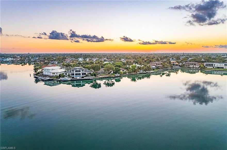 Enjoy the best of waterfront living with this well-appointed home situated on an oversized lot with sunset and long bay views. This custom property has vaulted ceilings and an abundance of natural light. The home is on a quiet street in one of the most desirable and established neighborhoods of Naples, the Moorings. The Moorings is close to downtown Naples and residents enjoy private beach access to the Moorings Beach Club. Bay Point, on Moorings Bay is a boater’s dream, the Bay is deep and was dredged for large boats. It is around the corner from Doctor’s pass, with direct access to the Gulf of Mexico. There are fuel and marina services, incredible restaurants, and shopping available at the Village Shops at Venetian Bay, a mile away. Sip cocktails while enjoying expansive views of the sunrise over the bay. Relax in the luxurious glass-enclosure featuring an outdoor kitchen and pool. Inside, experience an intelligent layout perfect for entertaining. Gorgeous vaulted planked wood ceilings are found throughout the home. Located just a short walk or bike ride to the Moorings private beach, you can feel the soft white SW Florida sand between your toes within minutes!