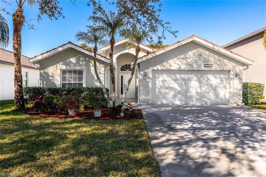 Located in Stoneybrook at Gateway, this well-cared-for 3 bedroom, 2 bath home offers a comfortable split-bedroom floor plan with an open living space that connects the kitchen, dining, and living areas seamlessly. The home features laminate and tile flooring throughout, with no carpet, making it both low maintenance and move-in ready. Several important updates have already been taken care of, including a new A/C system installed in June (2025), a newer water heater, and a climate-controlled garage with its own A/C system added three years ago. This added garage space creates great flexibility for storage, hobbies, a workout area, or workspace. Nearly all major appliances have also been replaced within the past two years. The screened lanai sits just off the main living area and overlooks a nicely landscaped backyard with mature shrubs and trees, offering a relaxing outdoor space with added privacy. Stoneybrook at Gateway is a guard-gated community known for its convenient location just minutes from Fort Myers, RSW International Airport, I-75, shopping, dining, and everyday essentials.