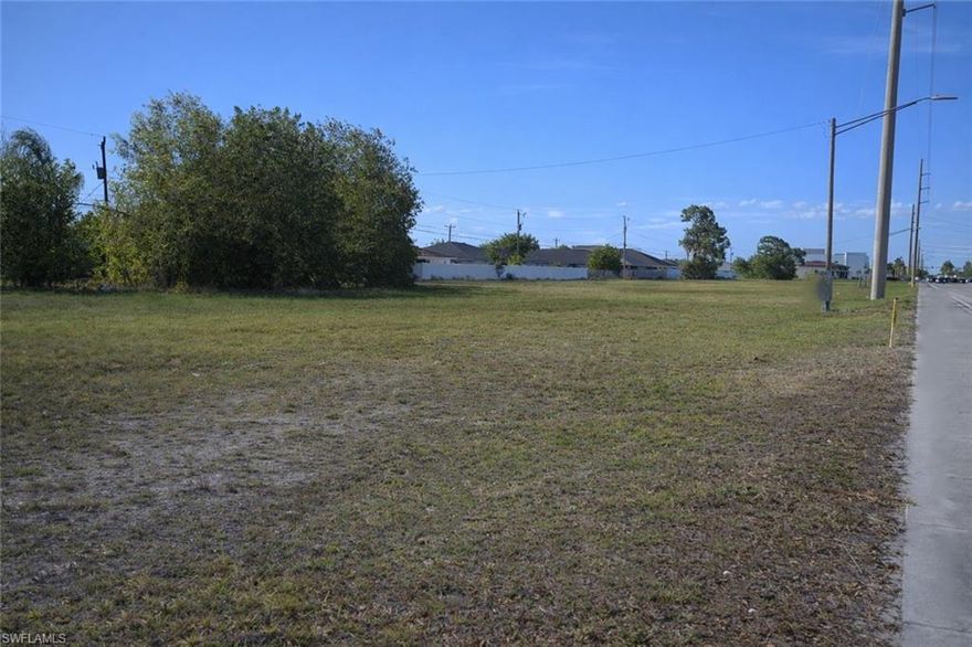 Prime commercial development opportunity located along Santa Barbara Blvd, one of Cape Coral’s most heavily traveled north-south corridors, with estimated TRAFFIC COUNTS exceeding 25,000–35,000 vehicles per day. This exceptional exposure provides maximum visibility for future retail, office, or mixed-use development and makes the site highly attractive to national and local tenants alike. This oversized 46,101 sq ft parcel features an impressive 341 feet of FRONTAGE, allowing for excellent access, signage, and curb appeal, and rear alley access. The property is ideally positioned within a dense residential population base and is surrounded by strong retail anchors, including Target and Lowe’s, as well as numerous restaurants, service businesses, and neighborhood retail centers that drive consistent consumer traffic throughout the day. The offer includes PLANS FOR A PROPOSED MULTI-TENANT RETAIL/OFFICE development, designed with modern architecture and strong street presence. The concept features multiple storefront units with expansive glass frontage. The site benefits from a strategic location near several schools, daycares, and family-oriented neighborhoods, including Cape Coral High School, which has over 2,000 students enrolled, creating strong daytime population and consistent traffic patterns. The proximity to educational facilities, along with nearby childcare centers and residential communities, makes this an ideal location for businesses catering to families, professionals, and daily convenience needs. Accessibility is a major advantage, with quick connectivity to Veterans Parkway, a key east-west corridor linking Cape Coral to Fort Myers and the greater Southwest Florida region. This ensures efficient traffic flow and enhances the property’s appeal for both customers and employees. From a development standpoint, the property is well-positioned to move forward quickly: City water and sewer are in place, All ASSESSMENTS are PAID in full, Not located in a flood zone, reducing insurance costs and development complexity. These factors significantly reduce upfront costs and timeline risk, making this a streamlined opportunity for developers and investors. The flexible development potential allows for a wide range of uses, including: Retail strip center , Medical or professional office, Restaurant or service-based tenants, Mixed-use commercial concept .With strong population growth in Cape Coral—now one of the fastest-growing cities in Florida—this corridor continues to see increasing demand for new commercial space.