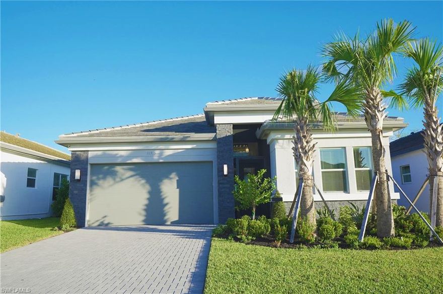 MOVE IN NOW! Better than new, this home has been done for you and is available NOW! Prepare to enjoy the Naples lifestyle with this spacious "Flamingo" floorplan, 2+ den, 2 Bath, Extended 2-car garage, and impact resistant windows throughout, Bonus options include custom closet shelving, outdoor lighting, screened in entrance plus much more. Offering perfect entertaining space, boasting a luxury kitchen with SS appliances and Quartz countertops. Main bedroom overlooks the screened patio & pool, with two walk-in closets. This features an exceptional lifestyle with resort-style amenities at the 43k sqft. clubhouse, including the resort-style pool, 70 ft. lap + resistance pool, firepit, w/restaurant, social hall, dance floor and stage, fitness center, salon, and more. Situated on 160 acres of pristine preserve with 3+ miles of walking trails and endless activities including pickleball, tennis, bocce, dog park, and more. Valencia Trails is located just minutes away from shopping and dining and provides a new standard of 55 plus living by offering an exciting vacation-inspired lifestyle that rivals the finest resorts with something for everyone to enjoy. Videos are from GL