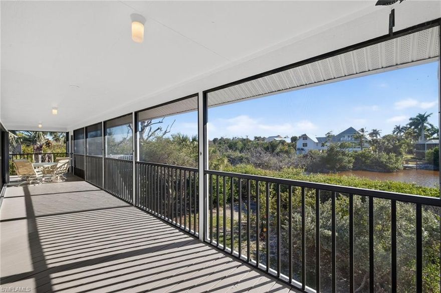 A huge screened lanai spans the full length of this lovely home and creates a tremendous amount of elevated outdoor living space. With sliders that line nearly every inch of this home's southwest exposure, the outdoor living space flows seamlessly with the indoor spaces. For years the current owners have referred to their home as their treehouse, which is entirely appropriate! Elevated and surrounded by native vegetation, a stunning array of birds, and the beautiful bayou that gives the community its name, this private, wooded home is a perfect way to be immersed in the nature of Sanibel. The house is extremely close to Bowman's Beach and its incredible shelling and to the Sanibel Recreation Center with its two pools, tennis, pickleball, and fitness opportunities. Blind Pass Beach and the restaurants and shops of Captiva are also closeby. The house has two full bedrooms with en suite bathrooms. A bunk room has been created where a laundry room was originally planned... it can easily be restored to a laundry room or continue to expand the accommodations of this charming home. A vertical platform lift at the front entry, adjacent to the 3 car garage provides fabulous convenience and accessibility. Enjoy the stunning sunsets from this incredible waterfront location and make this your treehouse at the beach!