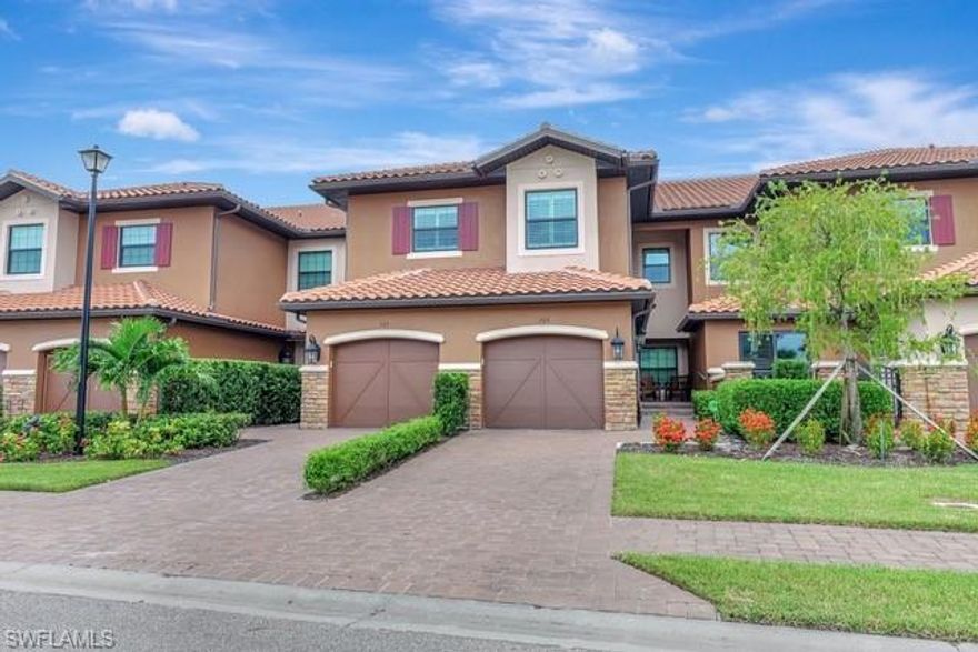 Live The Naples Lifestyle"-Your Dream Home Is Here! Discover the epitome of luxury living in this beautifully upgraded "BELLISIMO"coach home located in the Heart of Naples. Spanning 2,343 SQ.FT.(NO CARPET) featuring 3 bedrooms, 2.5 baths, a large private lanai with "NO ROOF TOPS" in VIEW and a 1-CAR ATTACHED GARAGE. Master Bedroom and two hall bathrooms were just freshly painted. This charmer boasts an open concept floor plan perfect for both everyday living and entertaining. 10-foot ceilings with recessed LCD lighting and elegant crown molding create an airy, sophisticated atmosphere throughout. The spacious kitchen is a chef's dream opens to family room, equipped with upgraded 42” white shaker wood cabinetry with soft close and some glass doors, pull-out shelving, stunning Cambria quartz counters throughout, upgraded stainless-steel appliances, and a large center island for added seating featuring a wine cooler and cabinets below for added storage. Adjacent to the kitchen is a separate oversize dining room with custom mill work, ideal for hosting memorable dinners with family and friends. The expansive great room is truly a showstopper, showcasing a custom-built marble tile wall with a linear remote-controlled fireplace, adding both warmth and style to your living space. From here, step out to enjoy the breathtaking views of the gorgeous wide and unobstructed lake and preserve views—a serene backdrop that brings nature and tranquility right to your doorstep. Nestled in a prestigious gated golf course community in North Naples, you’ll have access to fabulous amenities that enhance the luxury lifestyle. This stunning second floor coach home includes a CLUB/SPORTS/MEMBERSHIP giving full access to all of Esplanade's Golf and Country Club amenities including limited golf opportunities. The convenience of a one-car garage with an epoxy floor covering completes this exceptional offering. RELAX by the 2-NEARBY NEIGHBORHOOD POOLS! Don't miss out on the chance to own this meticulously designed and luxurious coach home in one of Naples' most sought-after prestigious communities! This luxurious coach home is loaded with premium upgrades, including HURRICANE IMPACT WINDOWS and DOORS for added peace of mind, ensuring your safety and comfort in all seasons, plantation shutters on all windows, custom master closet and pantry shelving, a remote operated lanai sunshade, 3 televisions with attached sound bars, 2 island bar stools, and many more updates to list! Esplanade Golf and Country Club is a prestigious amenity rich gated golf course community in North Naples. True resort pool with cabanas & poolside "Bahama Bar", 15,000 Square Foot Clubhouse, Tennis, Pickleball, Koquina Day Spa, 2 Dog Parks, 14 Miles of Trails for Biking, Jogging, or Walking, 18 Hole Private Course, Fitness Center, Restaurant, Bar, Wine Tasting Room, Private Wine Lockers, and Cafe. Esplanade is centrally located and minutes to Vanderbilt Beach, Mercato, Waterside Shops, Restaurants & more!