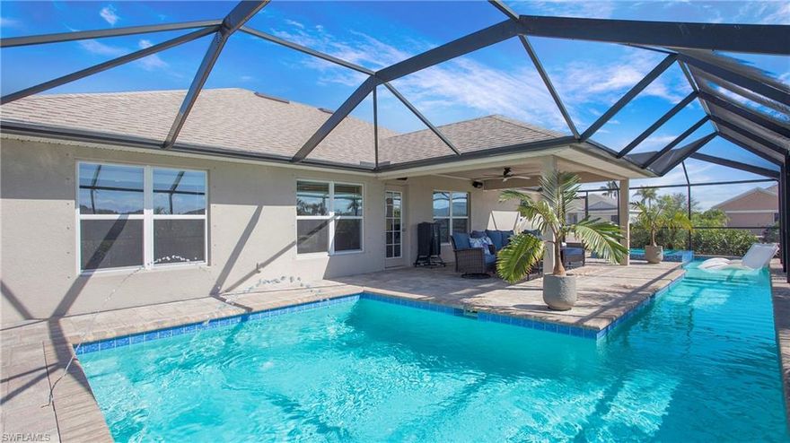 ***PRICED TO SELL at almost $40/sf LESS than other pool homes sold in NW Cape Coral***MOTIVATED SELLERS want to help a new owner make this their home*** 
Welcome to this spacious 4-bedroom, 3-bathroom home in Cape Coral, perfectly situated on a quiet corner lot NOT IN A FLOOD ZONE. Constructed by Adams Homes, the well-thought-out design is light and bright with soaring ceilings and an abundance of windows. Featuring a modern open-concept main living area and separate dining/sitting room, this residence offers plenty of space to live, relax, and entertain!  Step outside to the expansive lanai, where a CUSTOM, heated 477 sq ft pool awaits, complete with a lap lane, 3-5 ft depth, and a luxurious Florida Pebble Pearl finish. The pool features a Pentair Intelliflo pump with an Autopilot Salt Cell System, deck jets, and four LED color-changing lights—all controlled from a user-friendly app. The 360-degree infinity spa boasts four therapeutic jets for the ultimate relaxation experience. In addition to a spacious indoor and outdoor living, you'll experience sound peace of mind in this home as safety and maintenance upgrades include whole-house high-capacity surge protection, safety-tempered windows, and gutter system with extensions for excellent water diversion. Additionally, this home is not in a flood zone, so no flood insurance necessary! This home is a rare find combining comfort, thoughtful upgrades, and a resort-style outdoor space for all your entertaining needs. With easy access to all of the best dining, shopping, and entertainment in Cape Coral, you can live your Florida dream life here!