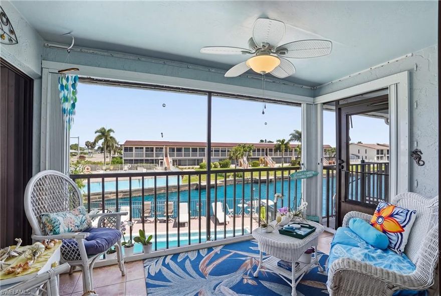 Craving a low-maintenance waterfront lifestyle with beautiful canal views and Gulf access for your boating adventures? Welcome to your perfect coastal retreat in the highly desirable 55+ Royal Palm Condo community, where effortless Florida living meets everyday convenience.

This beautifully updated 2-bedroom, 2-bath upstairs end-unit condo offers a light-filled, coastal-inspired interior with no carpet, neutral tones, and tasteful finishes throughout, creating a clean and inviting space that feels both modern and timeless. The open-concept layout flows seamlessly from the updated kitchen—featuring crisp white cabinetry, sleek countertops, and bar-top seating—into the spacious living and dining areas, ideal for relaxing or entertaining.

Unwind on your private screened lanai overlooking the canal, where peaceful water views and passing boats create the perfect backdrop for morning coffee or evening sunsets. The end-unit positioning provides added privacy and abundant natural light, while the thoughtfully designed layout offers comfortable living for both owners and guests. The primary suite is generously sized with an en-suite bath, and the guest bedroom is equally welcoming for visitors or seasonal stays.

Boating enthusiasts will love the canal-front setting with community boat docks and slips, offering Gulf access with just one bridge to the river and approximately 10 minutes to open water—making it easy to enjoy days out on the boat. The community also features a waterfront pool area, perfect for soaking in the Florida sunshine in a relaxed, social setting.

Additional highlights include a new roof, new carport, and negotiable furnishings, creating a truly move-in ready opportunity. Whether you’re searching for a full-time residence, seasonal getaway, or investment property, this home offers exceptional flexibility in an unbeatable location—just a short stroll to downtown Cape Coral’s restaurants, shopping, and entertainment.

Experience the charm, convenience, and lifestyle this waterfront gem has to offer—your slice of paradise awaits.