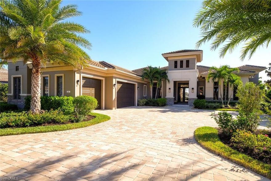 This 4-bedroom contemporary lakefront home built by Imperial Homes offers a dramatic view of both the lake and golf course.  The great room living area opens up to an expansive screened-in lanai that offers a 40-ft. swimming pool, spa, outdoor seating area with fireplace, and a dining area with an outdoor bar/kitchen/gas grill perfect for entertaining.  The sleek kitchen has Jenn-Air Professional series appliances and even sports a built-in coffeemaker.  Relax on the beautifully furnished Ralph Lauren living room sofa/suite, and enjoy watching TV above the linear gas fireplace in the great room.  The master bedroom is elegantly furnished with Stickley furniture, while Robb and Stucky completed all the outdoor furniture.  The master bedroom and living rooms are temperature controlled with a Nest thermostat.