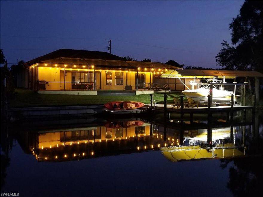 Elegance, quality & function are perfectly paired in this beautiful GULF ACCESS pool home. BETTER than NEW executive home full of extra amenities you won’t find in new construction. For the boater, enjoy a new wrap around COMPOSITE DOCK with 10,000 lb BOAT LIFT, CANOPY, remote control plus kayak dock. You’ll love the full length pavered lanai with picture frame cage & custom swimming pool. This 30x14 activity style pool features an infinity edge design with waterfall, Pentair Glo color changing lights, auto fill, electric pool heater & outdoor pool bath. Greatroom style design features 3 large bedrooms, den/office & gorgeous views of the pool & water. Lovely kitchen with 42” wood cabinets, crown molding, soft close doors, new granite counter & backsplash, stainless steel appliances & pantry. Bathrooms feature granite & soft close cabinets too! So many extras: All tile flooring, oversized 2 car garage, 8’ sliders, pavered driveway, tile roof, hurricane impact glass & doors, ALL assessments PAID, manablock plumbing & SO MUCH MORE! Why build & pay doc stamps, title insurance, & buy for tons of extras not included with a builder! This meticulously maintained home is READY NOW.