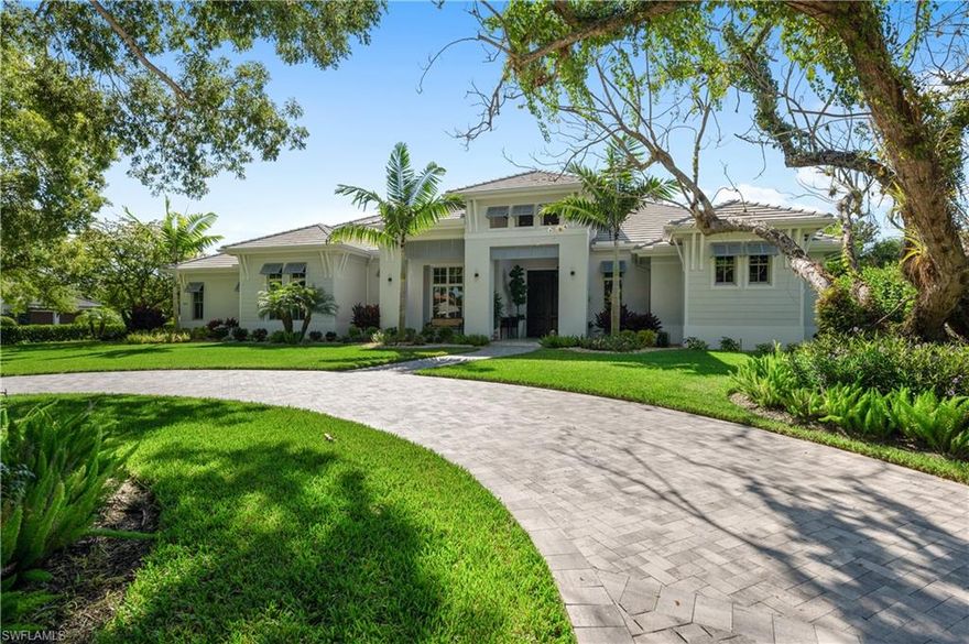 Like new West Indies, Coastal Contemporary custom home with southern exposure is perfectly positioned on oversized corner lot nestled amongst the beautiful Banyan tree-lined streets of Coquina Sands. This fully automated home; all situated on 1 level, with 4 bedrooms plus a study and 6 baths was professionally designed to address the needs of today's discerning buyer.  This light & bright masterpiece with a large great room, grand double island kitchen and spacious, fully-equipped, covered outdoor living area is well suited for indoor-outdoor living and entertaining.  The beautiful circular driveway creates a distinctive, separate, inviting & serene entryway while the large side-entry driveway provides additional utility and parking. With 3 oversized fully finished a/c garages, this beautifully landscaped home is just a short walk to the world-renowned Naples Beaches.