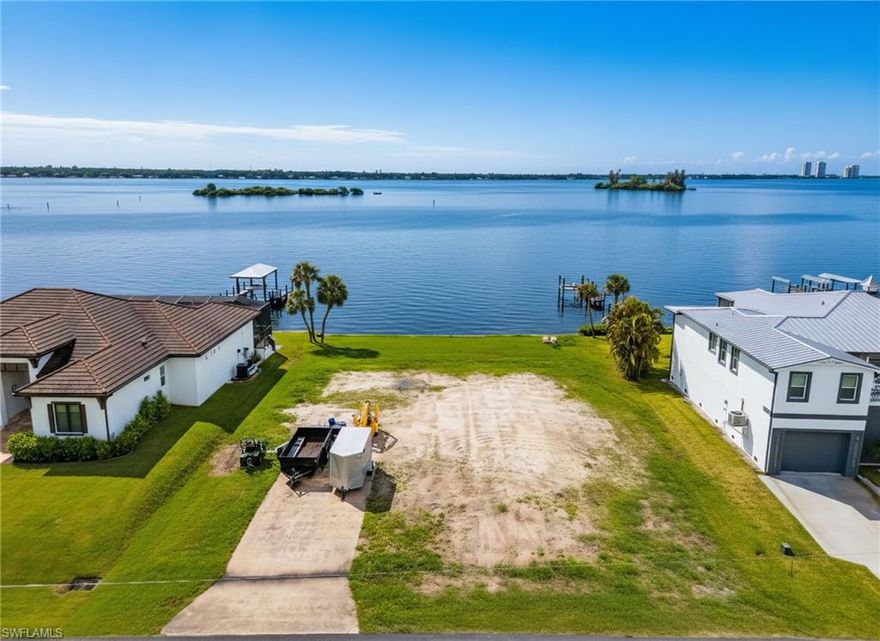 Build-to-suit! A Front-Row Seat to Stunning River Views! Rare waterfront opportunity overlooking the Caloosahatchee River with unobstructed views of downtown Fort Myers. Enjoy breathtaking sunrises and sunsets with a mangrove island just offshore that serves as a rookery for Roseate Spoonbills, Great Blue Herons, Night Herons, Egrets, and more. Manatees and dolphins are frequent visitors, making this a true nature lover’s paradise. The existing structure sustained storm damage and has been cleared, presenting a prime opportunity to build your custom riverfront estate. Surrounded by new construction, this is a builder’s and investor’s dream. Located in Yacht Club Colony, residents enjoy a private riverfront park with pavilion, BBQ area, beach, playground, and boat ramp. Direct Gulf access.  Don’t miss this chance to create your perfect waterfront retreat!