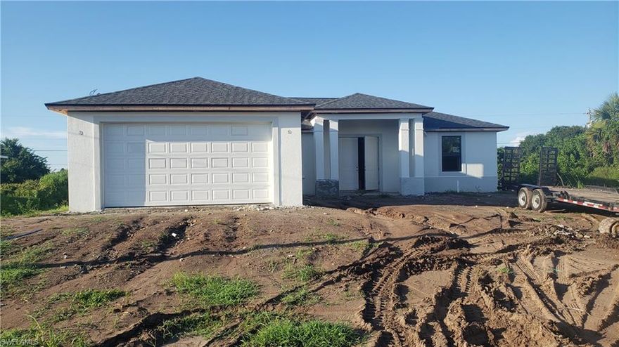 NEW CONSTRUCTION SINGLE FAMILY HOME ON A LARGE LOT WITH NO ASSOCIATION DUES! It has an anticipated completion date of mid December 2021. The home is a 3 bedroom w/ 2 designer spacious bathrooms. Gorgeous contemporary layout w/ open concept kitchen, split bedroom floor plan, luxury plank flooring throughout, quartz countertops, contemporary double door front entry, large slider system on rear of home, laundry room w/ utility sink, volume ceilings, walk-in closet & frameless shower enclosure in master bath, and 2-car garage. You will love this amazing home with top quality construction!