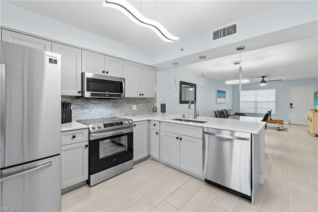 Photo of 4975 Sandra Bay DR #103, NAPLES, FL 34109 (MLS # 226017804)