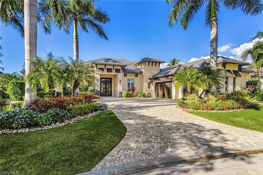 Discover unparalleled resort-style luxury in the award-winning Miromar Lakes Beach & Golf Club. This exquisite single-story lakefront residence spans 4,221 sq ft under air (7,484 sq ft total per attached floor plan) on a rare .49-acre pie-shaped lot, featuring 192 feet of prime waterfront and a large, usable side yard for exceptional privacy and outdoor enjoyment. Northwest exposure captures picturesque sunsets and expansive wrap-around lake views.
Built by renowned luxury builder Divco Custom Homes as their premier showcase model, the home has since been elevated by the owner with over $1,000,000 in meticulous upgrades and remodels. These include a fully reimagined gourmet kitchen with premium Viking appliances, dual dishwashers, and custom cabinetry; fully gutted and rebuilt spa-like bathrooms (all bedrooms ensuite); designer faux finishes, shiplap accents, and thoughtful enhancements throughout. Additional premium features include full impact glass, a six zone AC, whole-home natural gas generator, Sonos audio system, Control4 lighting, and Luxel WiFi for seamless modern living. Enjoy 4 ensuite bedrooms plus a media room, 5 full + 1 half baths, and a 3-car garage. Step outside to a private floating composite dock with captain's walk for effortless boating on 700-acre freshwater Lake Como (pontoon boat negotiable). Seamlessly blending indoor and outdoor living, a corner pocketing glass sliding door from the family room opens fully to create an expansive, open-air feel. The screened lanai becomes an incredible extension of the home with travertine decking, a gourmet outdoor chef's kitchen, an amazing outdoor television setup, dedicated living and dining areas, a tanning/sun shelf zone, a large spa accommodating up to 8 people, a lap-friendly pool for exercise, and a fun splash pad area perfect for kids—ideal for year-round relaxation and entertaining. Embrace the Miromar Lakes lifestyle centered on Lake Como's 3 miles of private white-sand beach—ideal for powerboating, water skiing, kayaking, paddleboarding, and fishing. Boat directly to the Beach Clubhouse docks for unique dining experiences right at the water's edge. Indulge in fine dining at the beachfront Blue Water Beach Grill and other on-site venues; rejuvenate at the European-style Wellness Spa with full-service salon; energize in the attended fitness center; or unwind by the 10,000-sq-ft zero-edge infinity pool. Additional perks include Har-Tru tennis, pickleball, and bocce courts; Botanical Park; and concierge services. Optional membership unlocks the remastered Arthur Hills Signature championship golf course (7,400 yards). As the only community to earn Gold Awards for both #1 Community and #1 Clubhouse from the National Association of Home Builders, Miromar Lakes delivers unmatched resort luxury. Explore further with the Zillow 3D Home Tour, video, and attached floor plan. Exceptional upgrades blend with serene privacy and prime waterfront access. Schedule your private showing today.