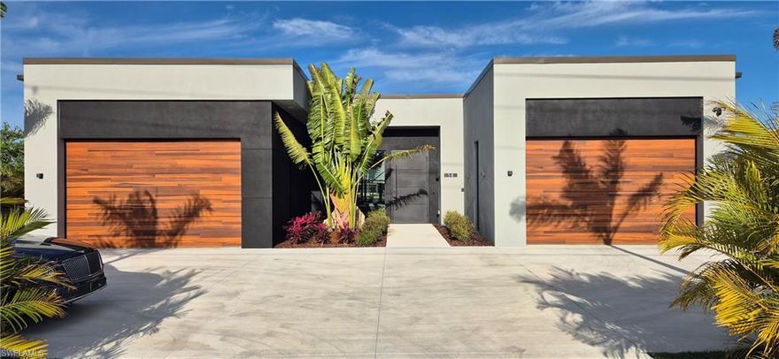 This elegant, all custom-designed home features direct Gulf access with a stunning lake view, 4 bedrooms and 3 bathrooms, and a 4-car garage (two separate 2-car garages). Highlights include LED tray ceilings, a modern kitchen with quartzite counters, 10’ high and 20’ wide disappearing hurricane sliders in the living room, hurricane-impact windows and garage doors, a 10’ metal front door, solar attic fan, self-cleaning water filter, white marble pool deck, 360-degree spillover spa, saltwater system, pool heater, negative edge pool, picture window pool screen, and much more. The ICUBE is not just a modern house, it is a welcoming home for those seeking elegance, luxury, and an individual lifestyle unlike anything else. All materials, fixtures, lighting, and details are handpicked and of high quality. The home features three individually designed bathrooms, custom walk-in closets, a chef’s kitchen, a custom pool, and more. Pictures and words cannot fully capture this outstanding home. Take your time to see and experience the ICUBE.