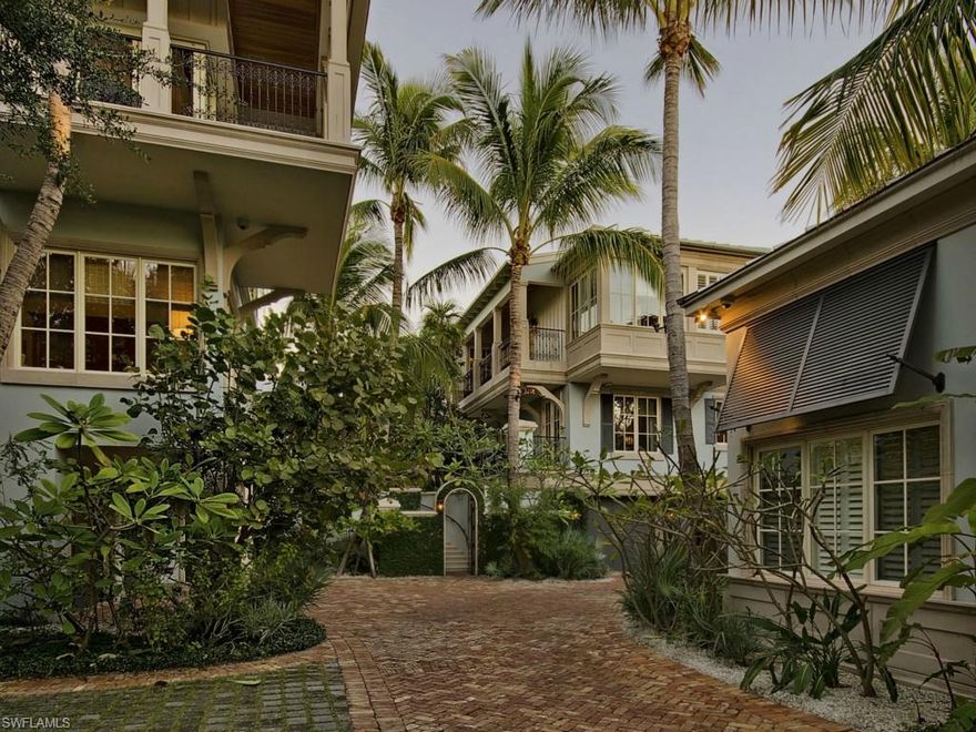 H.7995 - Designed with functionality as well as beauty this luxury home is not only sophisticated but truly elegant offering a perfect balance between formality and livability. Thoughtfully designed by Jeff Harrell in the style of a Caribbean plantation this home presents a clean breezy tropical Florida look with enriched interiors that feature wide-plank black walnut floors and white millwork throughout. This luxury compound offers five bedroom suites plus retreat / study where interior and exterior rooms seamlessly flow that create a resort like atmosphere. Idealistically situated on Champney Bay with serene views of the beyond estuary the lushly landscaped grounds with a mature tropical ambiance create a perfect balance with nature. This property also qualifies for a full Port Royal Club membership.