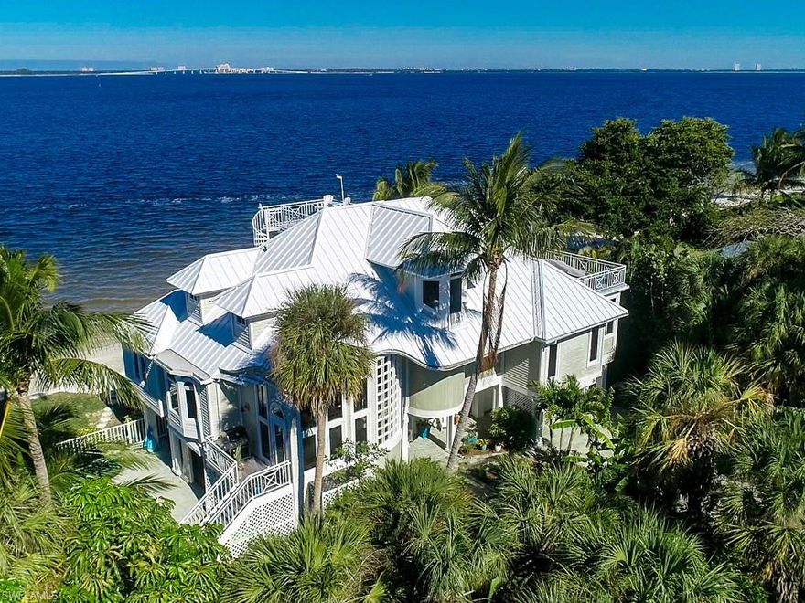 A rare opportunity to own a Bayfront home on one of Sanibel’s most prestigious private streets. This stunning beach home offers panoramic water views from its very private setting. Meticulously built and maintained including a brand-new metal roof, hurricane windows and shutters. The view is like no other as you’ll feel like you are sitting right on the water! Fish, sail, boat and shell all right from your own beach. Enjoy multiple porches and decks plus a crow’s nest offering 360-degree views. The home has a private office with room for more plus a workout area, 150 bottle wine fridge, room for the kids to play and lots of built-in storage. The pool is very private on the side of the home with great light and walk out access from the house. Restaurants, Marina, Gulf beach access and more are all within a 3 minute bike ride. Located on the East end just minutes from the bridge for easy access to and from the mainland.