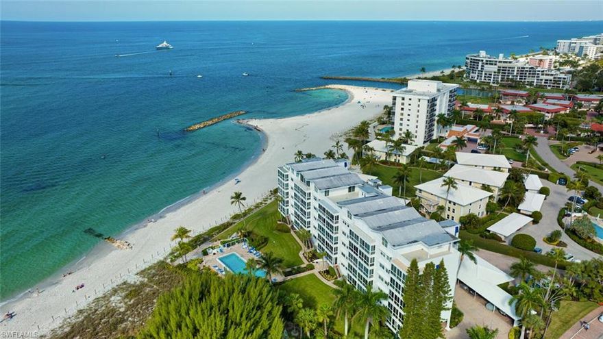 C4315.  Tremendous Gulf of Mexico Views with Naples Pier in the backdrop! Low-density mid-rise building with only 42 units. This 2 bed 2 bath unit is unrivaled with its long stretching sandy views, building positioning, and close proximity to 5th Avenue and 3rd St for dining and shopping. Tile flooring in baths and living areas, carpet in bedrooms. Includes furnishings so all you need to do is enjoy! Impact glass windows. Located directly on the beach and south of Doctors Pass for easy access to town.