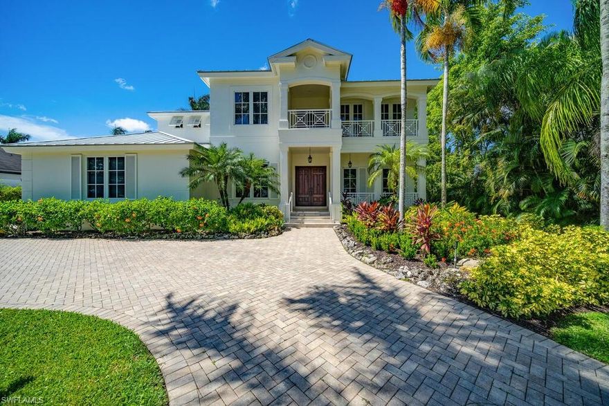 Recently refreshed and updated this Moorings Southern exposure home is situated in a prime location west of Crayton road in one of Naples most sought after areas. Built with sleek elements and an open floor plan design makes this a sought-after gem in the Naples area. Rooms are spacious, and include 6 bedrooms, 5.5 bathrooms, all spread over 4,776 square feet under air and 6.670 square feet total. Upgrades include a new roof, new paint and new impact glass windows and other room notables are only fitting for a home of this magnitude, remodeled bathrooms, a wood staircase with a custom iron railing, multiple sets of large French doors, detailed crown moldings and base boards, led fireplace in family room, coffered and volume ceilings for added appeal, gourmet kitchen with stainless steel appliances, and custom cabinetry with glass inserts, and custom marble and Brazilian cherry wood flooring. The upstairs includes a large loft area with a wet bar and 4 en-suite bedrooms. The lanai is a true retreat, large pool and spa, a large seating area, outdoor kitchen and lush tropical landscaping. This home is within short walking distance to the Moorings private beach!