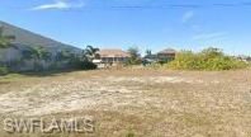 Paradise awaits you in NW Cape Coral. Build your dream home on this 3-lot site. Plenty of room for that large home, garage or backyard lanai where you will enjoy those beautiful Western sunsets and the intersection canal water views! Quick Gulf access from this 128+-' canal just minutes to Matlacha, Pine Island, Sanibel islands and Gulf of Mexico all offering an abundance of fishing, beaches and boating opportunities. Just minutes from the projected future development of the 7 Islands Project.