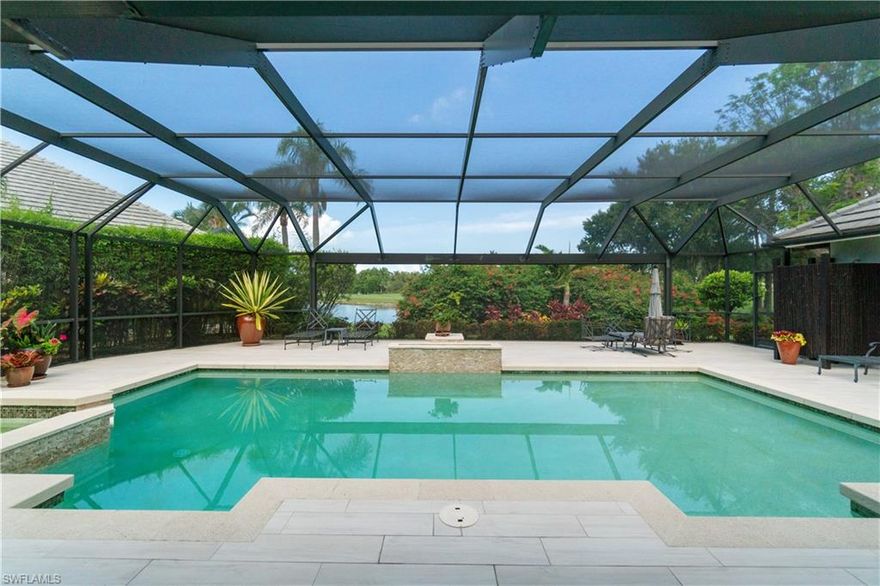 Beautifully renovated estate with stunning lake views in the prestigious Audubon Golf & Country Club in North Naples. Offers highly sought-after WESTERN exposure for breathtaking sunsets and optimal sun over the pool. This beautiful residence offers 3,204 sq ft of luxurious living space with 3 bedrooms, a den, a 2nd den/sitting room off the primary suite, 3 bathrooms, wood-look tile flooring, and custom wood detailing throughout. Additional highlights include hurricane impact windows/sliders and a new roof (2015). Step outside into your private backyard retreat—complete with a pool, spa, fire pit, outdoor shower, and a picture-frame screen enclosure providing unobstructed lake views. Inside, you’ll find the beautiful chef’s kitchen boasting stunning quartz countertops, custom wood cabinetry, and high-end appliances. The primary suite is a tranquil retreat featuring private access to the lanai, a cozy sitting area, generous walk-in closets, and a spa-inspired bath with dual vanities, a large frameless glass shower, and a separate jetted soaking tub. Audubon’s prime location is just 5 minutes from Mercato and world-class beaches, and the community offers a gated/guarded entrance, an 18-hole championship golf course, tennis, pickleball, a Bayside boardwalk, and a soon to be newly renovated clubhouse with dining and a second beautiful poolside club and café.