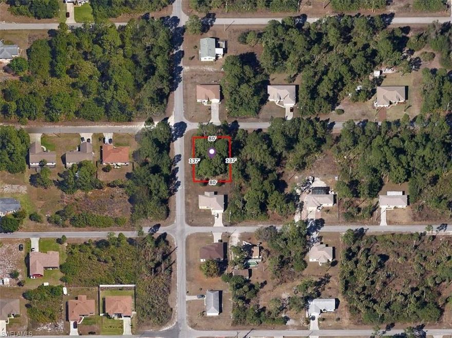 Prime single-family CORNER LOT just off Lee Blvd in Lehigh Acres! Located on a paved road with electricity, surrounded by new construction homes in a fast-growing area. Quiet street (not on a main road) with easy access to Fort Myers, shopping, and schools. Ready to build. NO HOA!