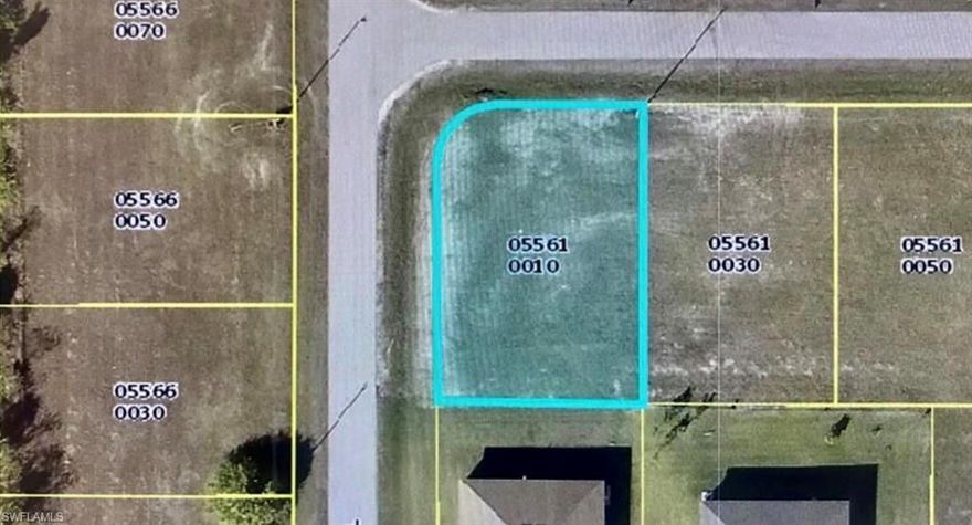 Dry corner lot in NE Cape Coral paved road with electric. Surrounded by houses. Excellent opportunity to invest in a developing area of Southwest Florida. Call today and send offers!