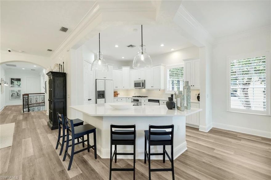 Step inside and you’ll immediately feel it—it’s chic, elevated, warm, and modern. Tucked away in the highly sought-after Cherry Oaks neighborhood of Fiddler’s Creek, this top-floor end unit is filled with natural light, peaceful views, and thoughtful upgrades that make everyday living feel a little more special. With over 3,000 square feet, you’ve got all the space you need—three oversized bedrooms, a flexible den (perfect as a home office, currently shown as a fourth bedroom), and three full baths. Plus, the private elevator makes coming and going effortless and offers multi-generational living. The main living area is open and inviting, with high ceilings, beautiful finishes, and plenty of room to relax or entertain. The kitchen is definitely a standout—completely updated with quartz countertops, a large island (with a built-in wine cooler), walk in pantry, crisp white cabinetry, and a 5 burner gas cooktop. Linger in the stunning dining room and enjoy the tropical views. Whether you’re hosting friends or just making a quiet dinner at home, it’s a space you’ll love spending time in. One of the best parts? The lanai. It’s large, screened-in, and perfectly positioned for western exposure—so you can unwind in the evenings with gorgeous sunset views over the golf course and surrounding greenery. The primary suite feels like a retreat of its own, with private access to the lanai, two walk-in closets, and a spacious bathroom with dual vanities, a soaking tub, and walk-in shower. Your guests will swoon over their own space—each bedroom is generously sized and has its own bathroom, giving everyone privacy and comfort.You’ll also appreciate the little things that make a big difference: new flooring, crown molding and deep baseboards, updated lighting, plantation shutters, a tankless water heater, and a two-car garage with extra storage. This home is beautifully appointed with furnishings negotiable, allowing you to move right in and enjoy immediately. Even sunrise is more enjoyable, as living on Cherry Oaks Trail, your eastern view is of beautiful one story single family homes with lots of open spaces to enjoy. Beyond your front door, Fiddler’s Creek offers a true resort lifestyle—pools, fitness center, tennis, pickleball, bocce ball, spa services, dining, optional golf with no waiting list, optional beach club on Marco Island, and more—all just a short drive from both downtown Naples and Marco Island.If you’re looking for a home that feels relaxed, refined, and ready to enjoy from day one, this one is it!!