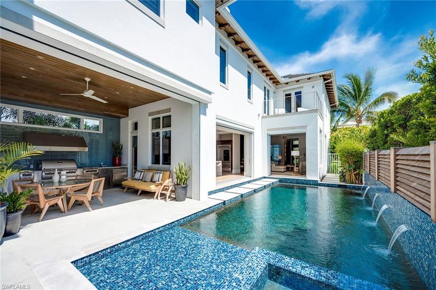 THIS IS WITHOUT QUESTION OLDE NAPLES’  BEST DEAL FOR A NEWER SFH 3 BLOCKS TO THE BEACH OR LESS / SELLER SAYS BRING ALL OFFERS. DONT LET DAYS ON MARKET DISSUADE YOU.   With a superior location and high quality construction standard, This stylish, well appointed residence is one block to Fifth Avenue shops and world-class dining and three blocks to some of the finest beaches in the country. At barely 4-years since initial purchase, this warm coastal contemporary villa should be at the top of your wish list. Deceivingly large at nearly 3,500 square feet under air, this home boasts four well-conceived bedrooms as well as a den/office and five-and-a-half baths. Completely redesigned pool and outdoor area coupled with a well-equipped outdoor kitchen make this a great find for entertaining or relaxing. Enjoy top-of-the-line appointments throughout and too many to list here. For the storm weary buyer, the second floor is concrete block construction (not wood frame like some others). Also this home has an ideal flood zone designation as well.