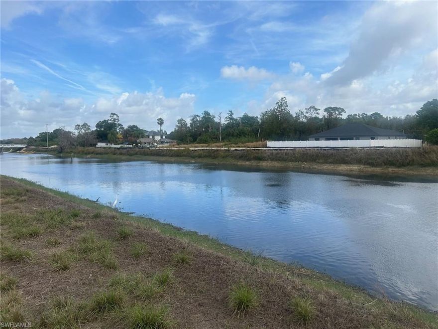 Premium waterfront opportunity on one of Lehigh Acres’ widest canals—135+ feet across for a massive, high-end water view. Located on a quiet dead-end street just off Sunshine Blvd, north of Lee Blvd, this property offers both privacy and prime positioning. Surrounded by new construction, with a brand-new home next door, this is a rapidly developing pocket. One of the best-priced waterfront lots of its kind—buy now, build, or hold for strong future upside. Bring your kayak!