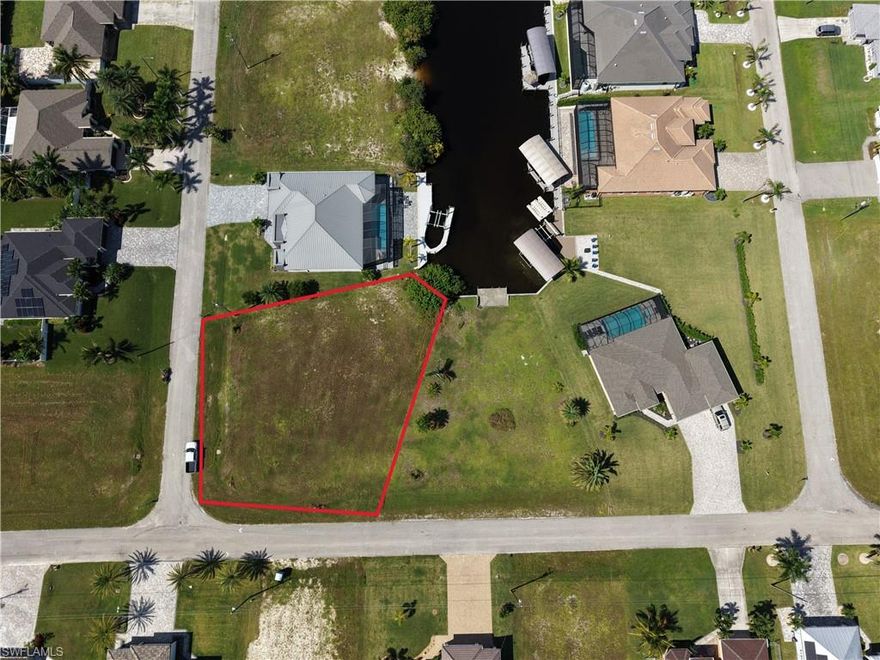 Build your dream home on this rare oversized 0.36-acre pie-shaped lot in one of Cape Coral’s most exciting and rapidly growing areas. Enjoy peaceful canal views with direct Gulf access, featuring only one bridge (approx. 9’ clearance)—perfect for boaters looking for quick and easy access to open water. This prime homesite is ideally located just minutes from the newly approved 7 Islands Project, a transformational development set to bring waterfront dining, boutique shopping, marinas, and entertainment, making this a strong opportunity for both lifestyle buyers and investors seeking future appreciation. With northwest exposure, you’ll enjoy stunning sunset views right from your backyard, creating the perfect setting for outdoor living, a pool, and a custom waterfront retreat. Opportunities like this don’t come often—oversized, Gulf-access lots near major waterfront developments are becoming increasingly scarce. Secure your place in Cape Coral’s future today.