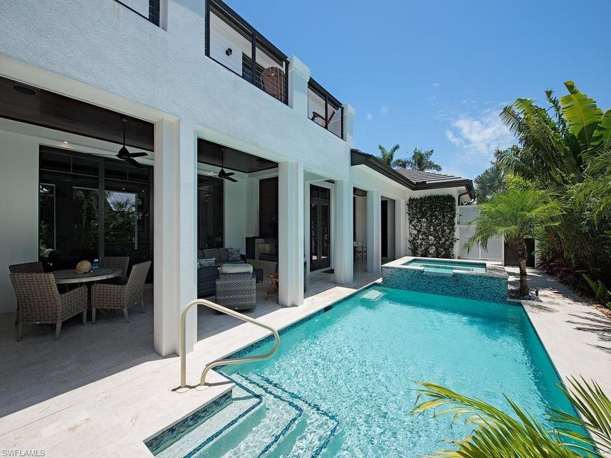 H.13165  Coastal elegance with a contemporary flair ONLY 2 blocks to the sugar sand beach. Completed in mid 2016 and gently enjoyed on a sought after north of Central avenue lined with overhanging Mahogany trees. A long list of Additions and Enhancements by this particular seller enhance an already enchanting home with coveted southern exposure, with access to the over-sized 3 car garage by a quiet alley. Walls of glass join the Zen-like outdoor living and entertaining area landscaped for privacy around the pool and spa, fireplace, media wall, and gas summer kitchen to the sophisticated interiors. A gourmet kitchen with two dishwashers, gas range, wine fridge and bountiful work areas, blend pale grays and whites over driftwood inspired wood floors throughout. The design features  flow from entry, past the sizable den to the spacious living room with fireplace and a subtle visual division to the “kitchen heart” of the home. The expansive master suite opens to a clearly Magnificent master bath. A glass wall slides to a privacy-walled landscaped garden with an extra outdoor shower. The second floor features three guest bedrooms with en suite bathrooms. CON'T IN CONF REMARKS