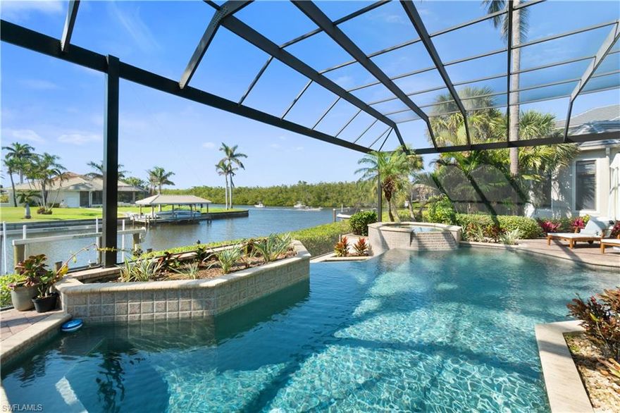 Stunning waterfront estate in a private gated enclave with boating Gulf-access & a 5-minute drive to the beach! HIGH & DRY DURING HURRICANE HELENE & MILTON WITH NO WATER INTRUSION! This magnificent coastal home is nestled just off the Imperial River with stunning wide water views—the land across the river is preserve/mangrove, providing rare privacy & immersing you in nature. Ideal for both beach lovers & boating enthusiasts, this home is just 5 minutes away from Barefoot Beach/Bonita Beach & offers easy Gulf access from your 10K lb. boat dock/lift (through Wiggins Pass or New Pass). Every detail is meticulously crafted from the new white oak flooring & beautifully renovated coastal contemporary kitchen to the dramatic great room with soaring 2-story lofted ceilings. Beautifully designer furnished & decorated in 2024 (furnishings negotiable)! Built like a fortress, this home offers 4,371 sq ft under air, 3-car garage, all concrete construction, 2023 NEW ROOF, hurricane impact windows/sliders, all A/C units new in 2021-2023 & a built-in generator. Features an INCREDIBLE 4 bed + den, 4.5 bath floor plan with all main living spaces on first floor & separate guest spaces upstairs. Main floor includes the spacious primary suite, office, a guest suite, the living room & family room, dual dining spaces, kitchen, wet bar & separate wine room. The newly renovated chef’s kitchen offers stunning white quartz countertops, custom white cabinetry, dual sinks & dishwashers, walk-in pantry & Wolf appliances including a gas range & double oven. Relax and unwind in your nearly 1,300 sq ft outdoor living space including infinity edge pool/spa (new pool heater in 2023), gas fireplace & summer kitchen with BRAND NEW Wolf grill, pool bath & ample dining/lounging spaces, all conveniently located off the main living level & enclosed in a NEW 2023 picture screen enclosure for the ultimate water views. Coveted Western exposure offers breathtaking sunsets over the river as boats sail by & dolphin splash as well as providing prime sun on your pool. The spacious primary suite is the ultimate private oasis with a sitting area, access to the lanai, 2 large closets with California style built-ins & a spa-like bathroom with dual vanities, jetted tub, & large walk-in shower. The second floor is very private & perfect for guests! Offers its own loft/living space, two guest suites with en-suite bathrooms & its own expansive screened-in lanai with fantastic river views. River Reach Estates offers easy maintenance with the lawn care & pool care all covered by the HOA! Excellent location near many excellent local restaurants & close to Mercato & the Promenade, with Waterside Shops, Coconut Point, 5th Ave & the RSW International Airport 30 minutes away. This coastal haven is the ultimate boater’s paradise and an exceptional opportunity for luxurious waterfront living!