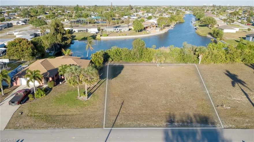 WOW! Come check out this Eastern Exposure facing LAKE view lot. Over ~180' of a view over Laguna Lake. CITY WATER AND SEWER PAID! Short drive to Pine Island Road. Unique opportunities like this do not last! Buy now and build your dream home on this huge quarter acre parcel, or hold for future investment. Taxes are LOW and there are no time restrictions on building, build when YOU'RE ready!