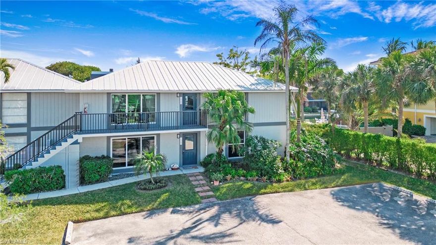 Back on the Market BETTER THAN EVER freshly painted with an new Modern Look !! Seller Financing now available for your Buyers to consider as well …Welcome to a Boater's Paradise in Oyster Bay, where luxury meets convenience in this south-facing waterfront condominium. This rarely available unit in The Boathouse building offers stunning water views from every room. With 6 units and 2 stories, this high and dry building has weathered recent hurricanes, including IRMA, IAN, Helene, and now Milton with resilience including zero flooding and zero insurance claims. Step into this first-floor residence with nearly 1,200 square feet of air-conditioned space, featuring two bedrooms with ensuite baths, including a walk-in shower and full-sized bathtub. Included with the residence is up to 27 feet of boat dock space equipped with water and electricity. Relax and unwind on the recently expanded 500-square-foot covered deck while enjoying tranquil canal views. Notable features of this updated unit include custom Impact Glass windows and doors for safety, privacy, and climate control, along with tile and wood floors, plantation shutters, a private den area, and a separate storage and laundry room. New linked smoke detectors ensure your comfort and safety, with over $35,000 invested in upgrades since this residence was on the Market earlier this year. Dock your boat right in your backyard and enjoy direct gulf access from Naples Bay, with no bridges to navigate. Embrace the Naples lifestyle by biking to Tin City and 5th Avenue for world-class dining and exploring the Naples beautiful beaches. Oyster Bay stands as one of Naples' best-kept secrets, offering a perfect blend of waterfront living and urban convenience.