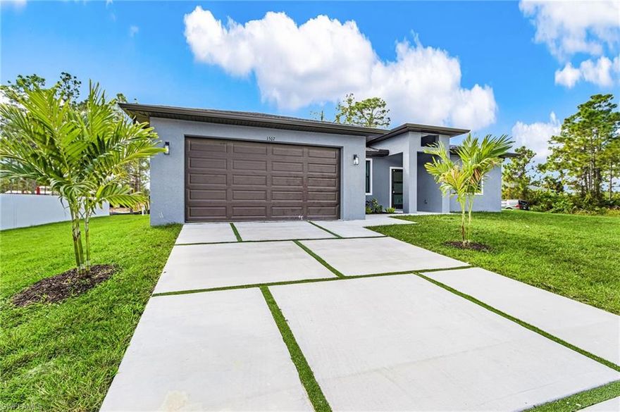 Modern new construction home located in Lehigh Acres, Florida, offering a perfect blend of design, comfort, and functionality.
This beautifully finished property features 3 spacious bedrooms, 2 full bathrooms, and a bright open-concept living area with high ceilings and porcelain floors throughout.
The contemporary kitchen includes an oversized island, quartz countertops, and stainless-steel appliances, creating an ideal space for entertaining. The master suite offers a walk-in closet and a luxury bathroom with dual vanities and a frameless glass shower.
Enjoy the outdoors in a covered terrace with a summer kitchen, perfect for family gatherings or relaxation.
Additional highlights include impact-resistant windows, a two-car garage, modern lighting, and no HOA.
Move-in ready — conveniently located near shops, schools, and main roads.