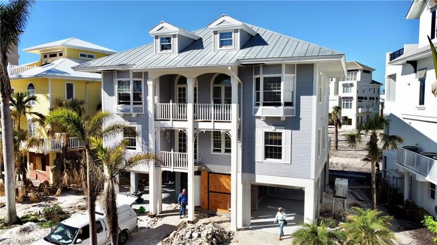 Enjoy unforgettable sunsets from this beautiful Barefoot Beach Home. This property is a blank slate, ready for the next owner to transform into something truly unique.