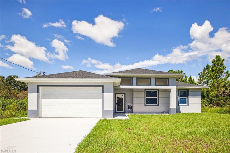 New construction 4 bed/3 bath with 2 Master Suites and a split floor plan. Home features impact windows, large porcelain tile throughout, and a bright open layout. Move-in ready with modern finishes and a serene natural setting.