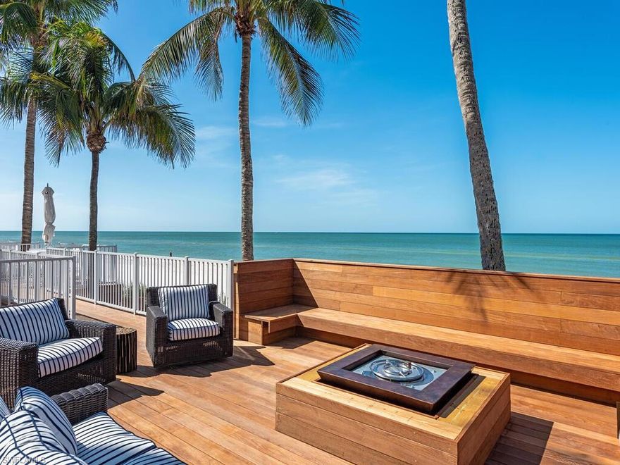 Immerse yourself in BEACHFRONT living, unobstructed Gulf views & breathtaking sunsets. This stunning 3 bedroom, 3 full bath Masterwork LIVES LIKE A VILLA with an east-facing ROOFTOP TERRACE & a PRIVATE SPIRAL STAIRCASE that leads DIRECTLY TO THE BEACH, pool, fire pit & grilling area.  Updated to the highest standards, the open kitchen is equipped with top-of-the-line Sub-Zero and Wolf appliances, Water Street hardware, Kohler farm sink, & quartz countertops,  perfect for culinary enthusiasts. The wet bar is complete with a Sub-Zero wine cooler & extra cabinet storage, designed for easy entertaining. Porcelain plank tile flooring adorns the living/bedrooms & Carrera marble flooring in bathrooms adds a touch of luxury. Impact sliders, HVAC 2022, & smart thermostats are thoughtful features prioritizing safety & comfort.  Custom window treatments & custom California closet systems organize each closet.  Enjoy the convenience of secure under-building parking & extra storage. The WALDORF is a STYLISH BOUTIQUE CONDOMINIUM building located in the prestigious Moorings neighborhood.  Olde Naples & Venetian Village are close by with shopping, restaurants, arts, & so much more.